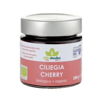 A jar of Bioitalia organic cherry jam, 260g, with the label indicating it is gluten-free and vegan.