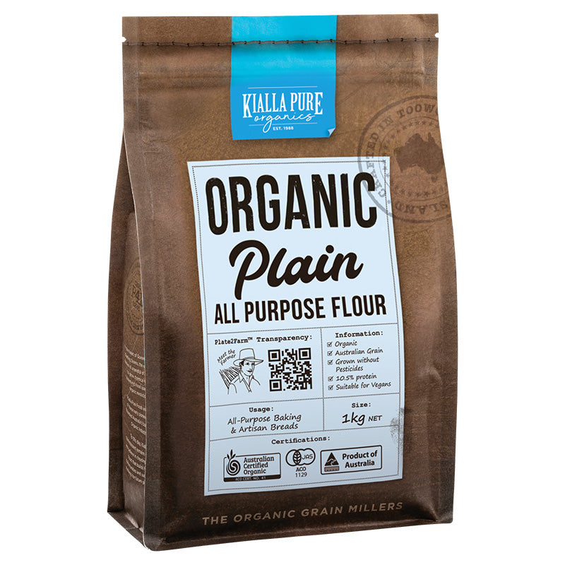 A package of Kialla Pure Foods Organic Plain All Purpose Flour, 1kg, with branding and product information on the label.