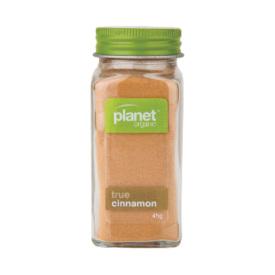 Jar of Planet Organic Cinnamon on a white background.
