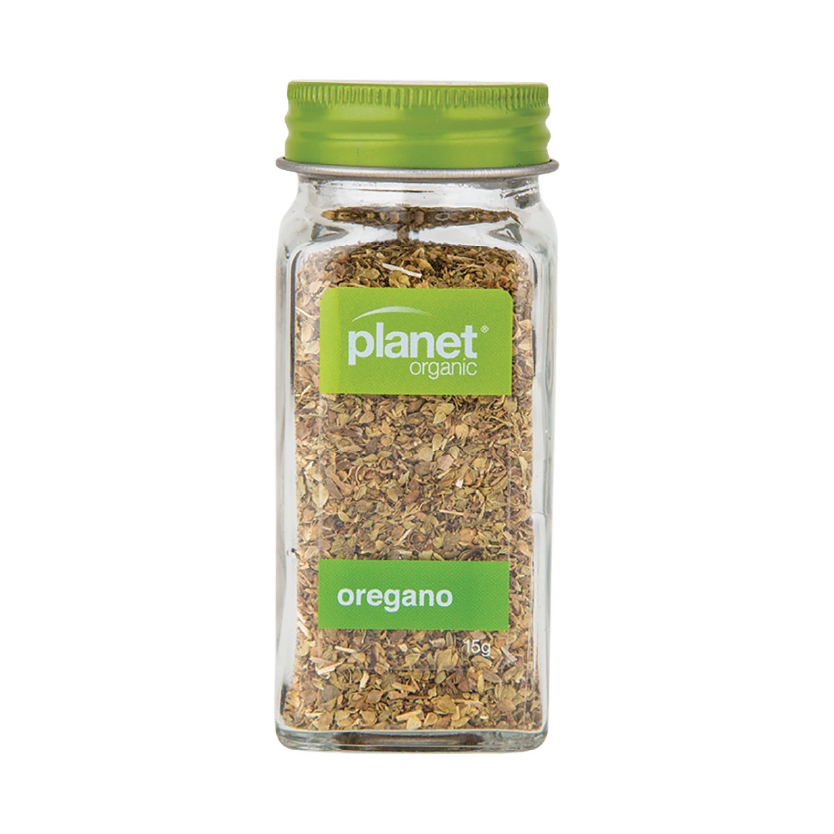 Jar of Planet Organic Oregano on a white background.